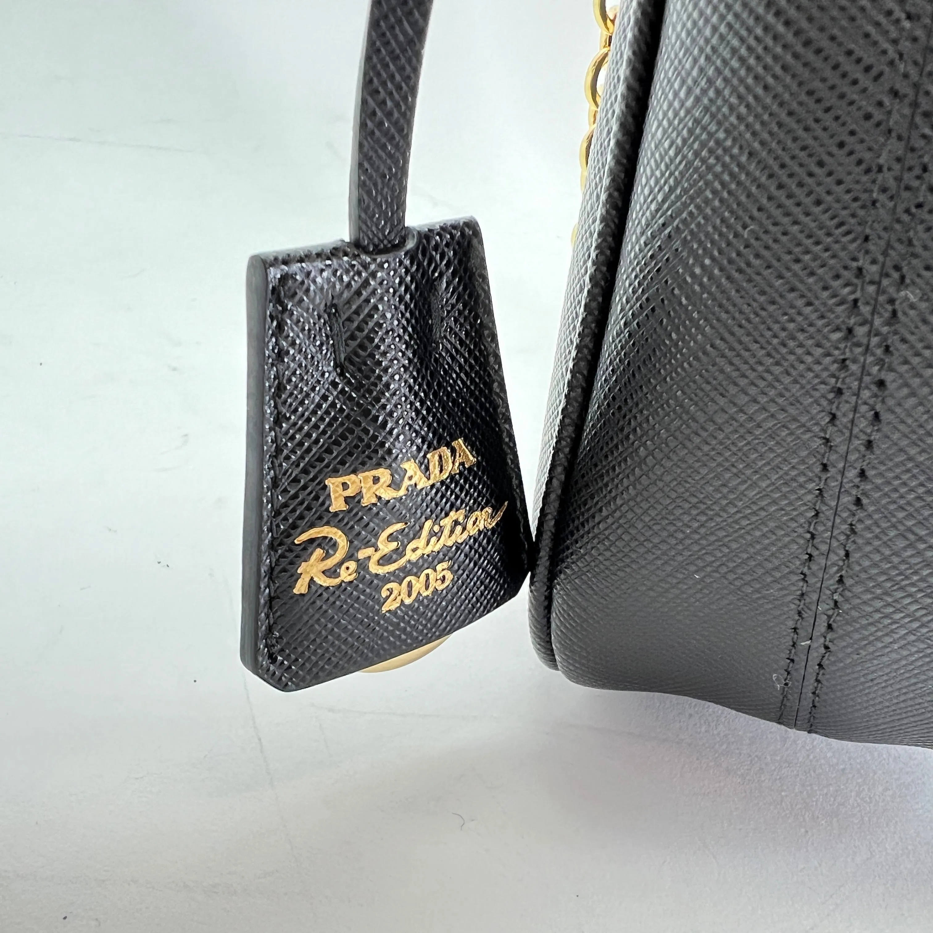 Re-Edition 2005 Black Crossbody Bag in Saffiano Leather, Gold hardware